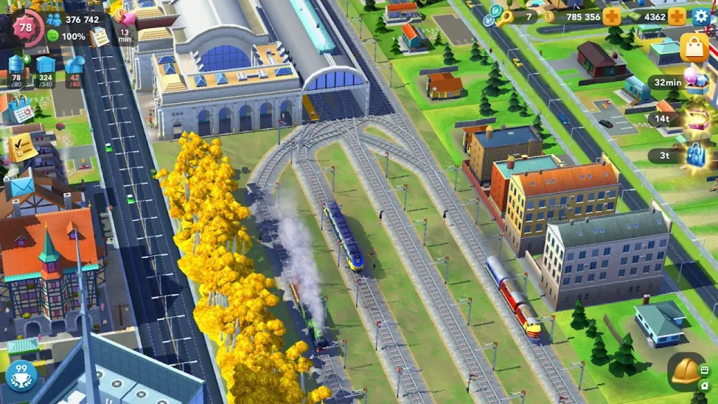 Vista aérea de avenidas, linha férrea e árvores em flor em SimCity BuildIt